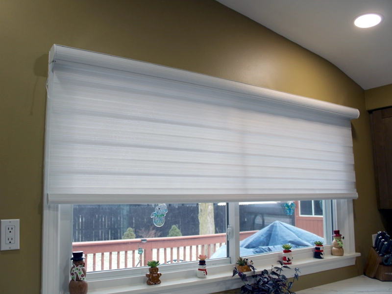Closeup view of custom transitional window shades installed in new kitchen