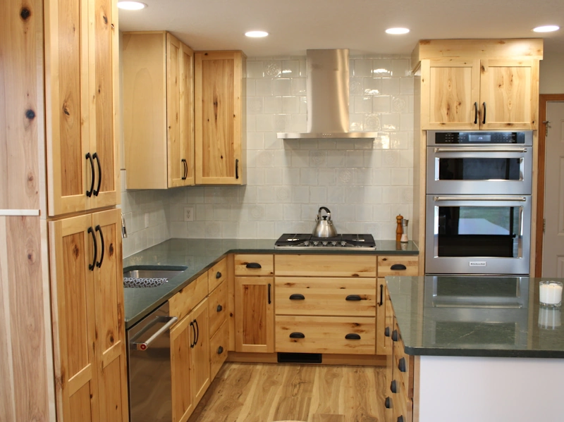 Medium photo of new kitchen remodeling project, showcasing hickory cabinets