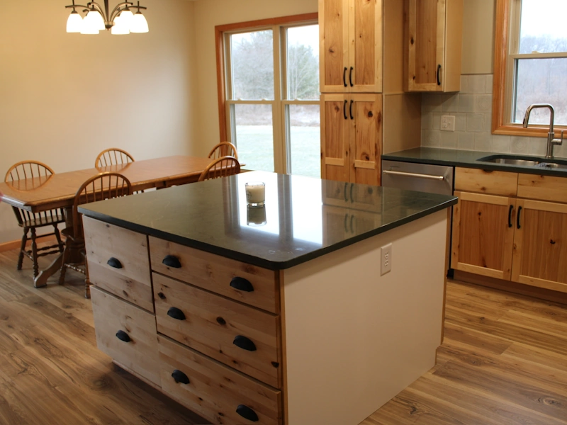 Ample storage featured in center island built in kitchen remodeling project